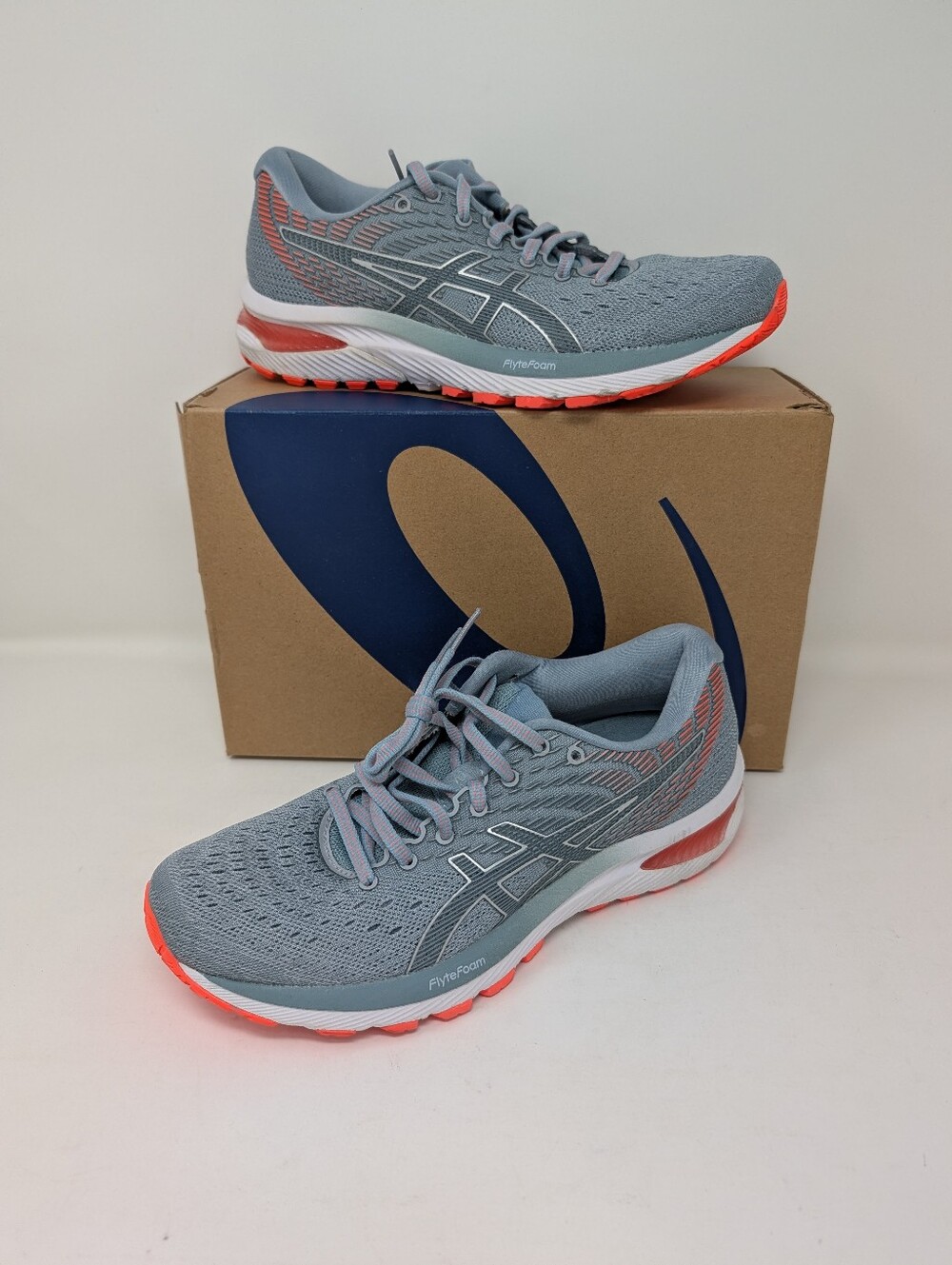 Women's ASICS sneakers, size 8. GEL-Cumulus 22.Blue/Grey with coral/peach accent
